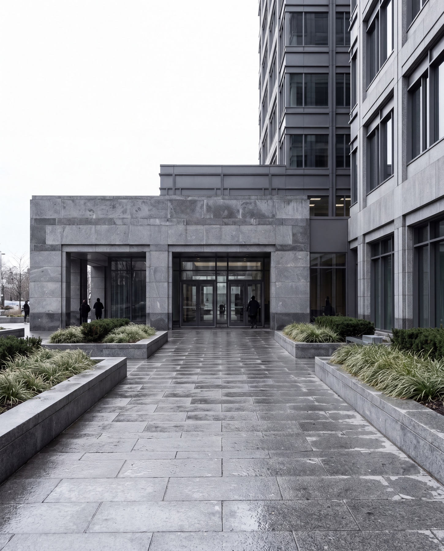 A large-format granite plaza frontage in the Greater Toronto Area under clean overcast daylight.